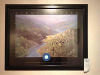 Full view of framed Burma Bombers print showing bomber aircraft over river and hilly landscape with title above and details below.