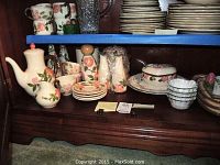 Photo showing full collection of Franciscan Desert Rose dinnerware including plates, teapot, creamer, cups, salt and pepper shakers, and covered dish.