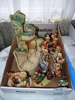 All figurines and scene laid out in box showing overall lot contents