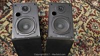 Pair of Acoustic Research speakers front view, black cabinets with two-way driver setup