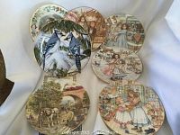 Six decorative collector plates with varied vintage and nature illustrations including birds, Victorian scenes, fairground, and canal.