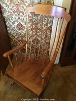 Front left angle view showing spindle back and armrest.