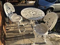 Full set on outdoor porch: table and two chairs