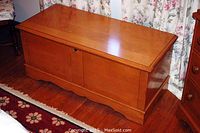 Chest closed, top and front view on hardwood floor