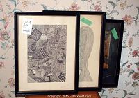 Three framed Ken Leeman ink drawings in black frames hung against floral wallpaper, showing abstract and geometric artwork.