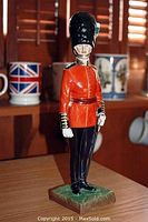 Front view of full 12-inch figurine on shelf