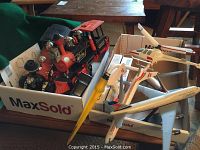 Box with two western style locomotive train models and models of Canadian Airlines Boeing 747 and 747-400, Wardair A310, Air 2000 helicopter, and a yellow sprinkler head.