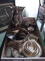 Box with pitcher and assorted trays and bowls