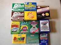 Large lot of assorted baseball card boxes featuring various brands such as Donruss, Fleer, and Topps from years around 1990 and 1991.