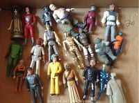 All approximately twenty 3.75-inch action figures laid out in cardboard tray