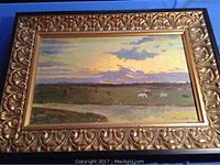 Full view of the framed oil painting showing landscape scene and ornate frame