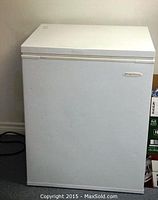 Front view of white Frigidaire apartment chest freezer with logo visible