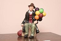 Front three-quarter view of the porcelain figurine on a wooden surface