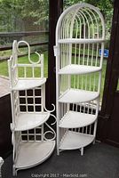 Both painted corner shelves side by side in a sunroom setting, showing overall structure and finish.