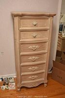 Full front view of six-drawer tall boy dresser showing overall appearance and finish