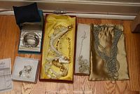 Overview of lot: sterling bangles, crystal drop earrings, beaded necklaces and bracelets, chain necklaces