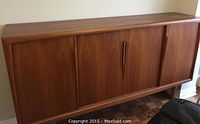 Front full view of mid-century teak sideboard with three doors