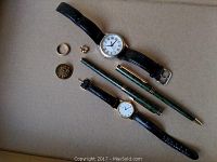 Overview of all lot items on beige surface