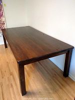 Full view of rectangular chestnut table showing top and legs
