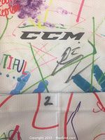 Photo showing close-up of CCM logo on white sock, Evan McEneny autograph, and number 2 stamped on sock.