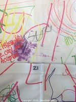 Close-up photo of the sock showing number 21 mark and colorful scribbles