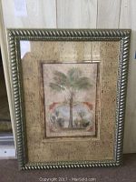 Framed vintage botanical print featuring palm trees in a gold-tone carved metallic frame with ornate detailing.