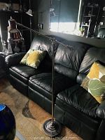 Full view of chrome adjustable floor lamp with weighted base and swing arm