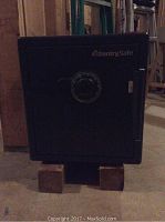 Front view showing mechanical combination dial, SentrySafe logo, and locking bolts.