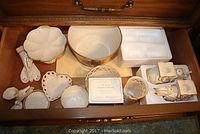 Top-down view of the assortment showing various Lenox decorative pieces including pedestal bowl, heart bowl, angel figurine, elephant candlesticks, and candy dishes.