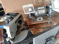 Craftsman compound miter saw and KFF dual bench grinder side by side on workbench