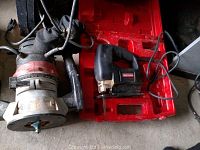 Craftsman electric router and sabre saw together on the ground, showing condition and cables