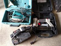 Overall lot view showing Skil 3x18 belt sander, Makita electric planer in turquoise case, and Porter Cable pneumatic nailer in black case