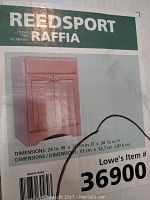Label showing Reedsport Raffia vanity cabinet with dimensions and brand info