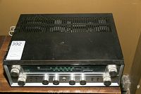 Top and front angled view of the Transwave TW-60 tube receiver showing ventilation slots and control knobs, with visible surface scratches.