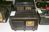 Two Stromberg-Carlson Bakelite radios side by side on table showing overall shape, color, and design