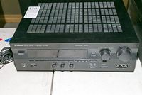 Top-down view of the full Yamaha RX-V495 receiver showing the vented top panel and front controls.