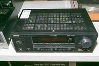 Front view of Yamaha Natural Sound AV Receiver Model HTR-6030 showing digital display, control buttons, and input jacks