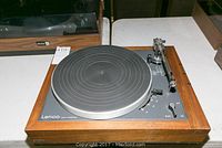 Full view of vintage Lenco turntable with wooden frame, gray control panel, and rubber turntable mat