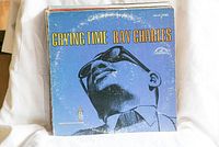 Vinyl record cover of 'Crying Time' by Ray Charles showing large blue cover with black and white photo of Ray Charles with sunglasses.