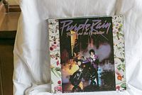Photo of Purple Rain Prince and the Revolution vinyl record album jacket with Prince on motorcycle.