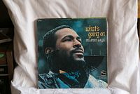 Front cover of What's Going On album displaying Marvin Gaye looking up with a blue background.
