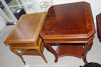 Two wood side tables placed on carpet showing tops and legs; one lighter rectangular and one darker octagonal with carved edges
