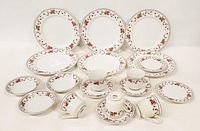 Full display of Sheffield Anniversary Fine China set with various plates, cups, and saucers arranged for view.