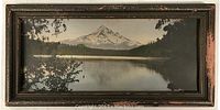 Framed vintage color photograph of a mountain landscape with lake and trees, 7 x 14.5 inches, under glass.