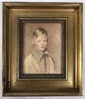 Framed watercolor portrait print of a young boy named Peter, showing the full frame and visible under glass.