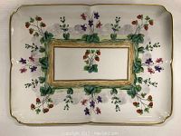 Top view of rectangular Limoges platter showing hand-painted strawberry and violet floral design with gold rim.