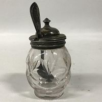 Clear glass mustard container with floral cuts and silver plated lid and spoon