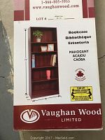 Photo of the Vaughan Wood bookcase box showing product image, dimensions, and mahogany finish with 'Made in Canada' labeling