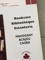 Close-up photo of the Vaughan Wood bookcase box showing product details including 'Mahogany' finish and 'Made in Canada' label.