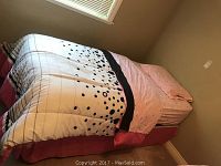 Assembled twin bed with comforter, bed skirt and pillow